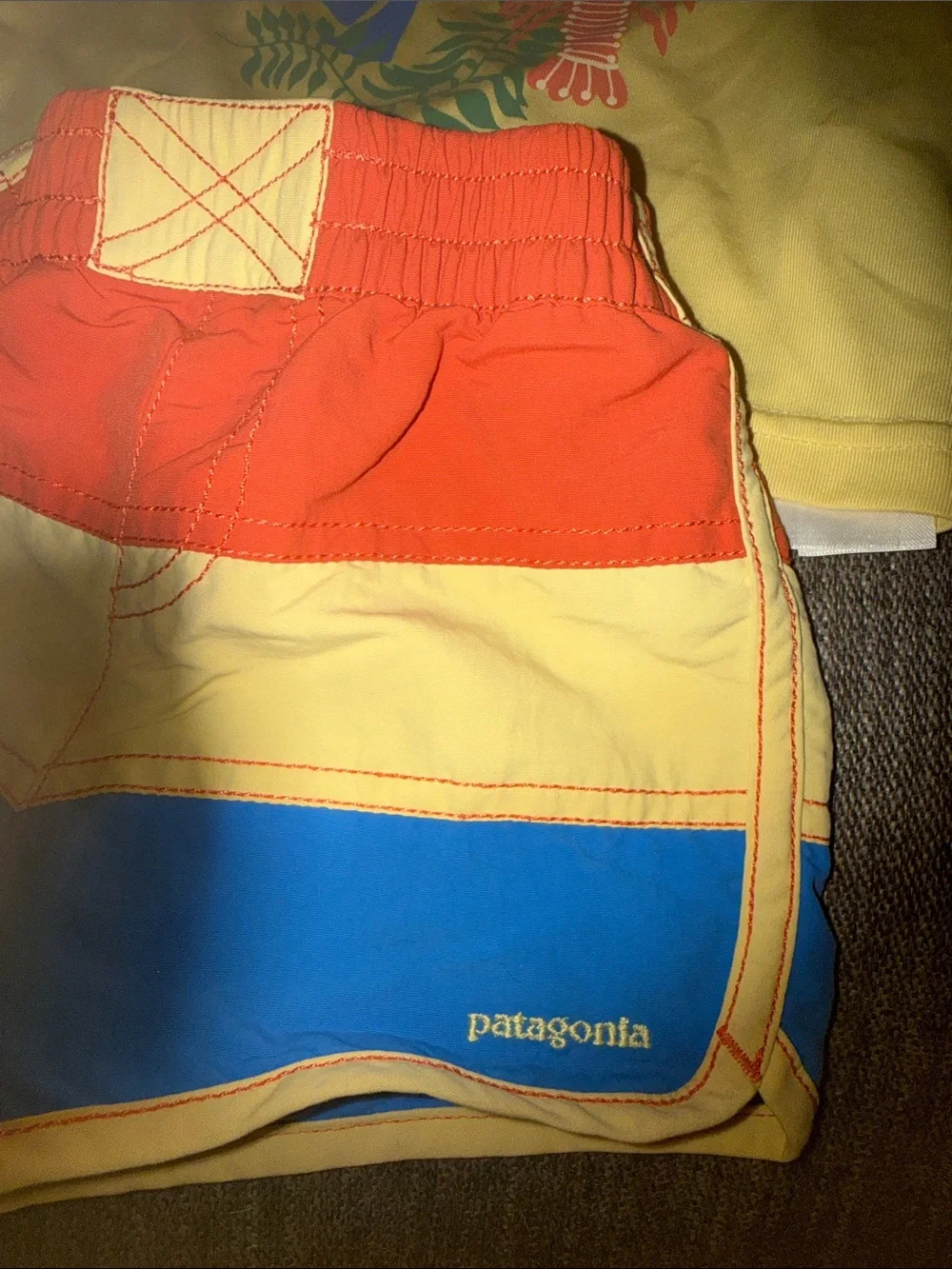 Patagonia Yellow Hoodie with Red, Blue & Yellow Colorblock Swim Shorts